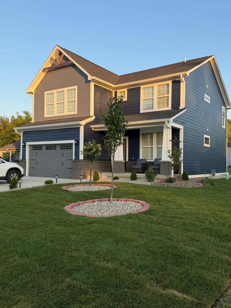 Modern two story home exterior lighting